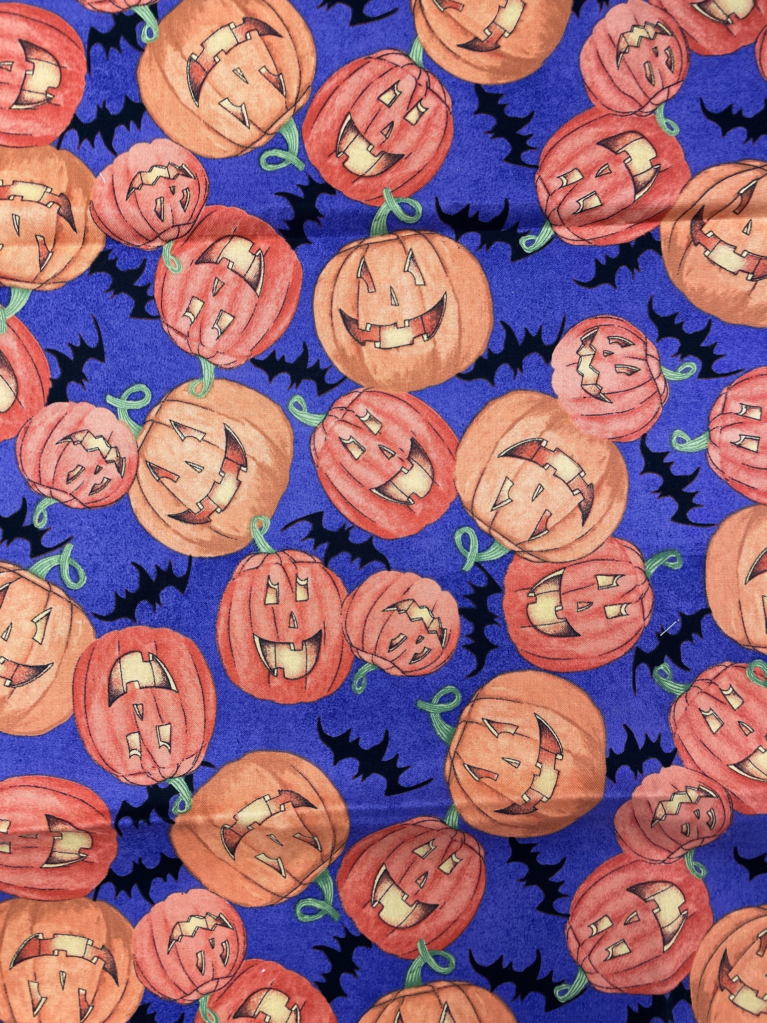 1 YD Quilting Cotton - Jack-o-Lanterns and Bats on Purple Background