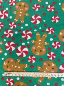 1 1/3 YD Polyester Polar Fleece - Gingerbread and Peppermints on Green Background