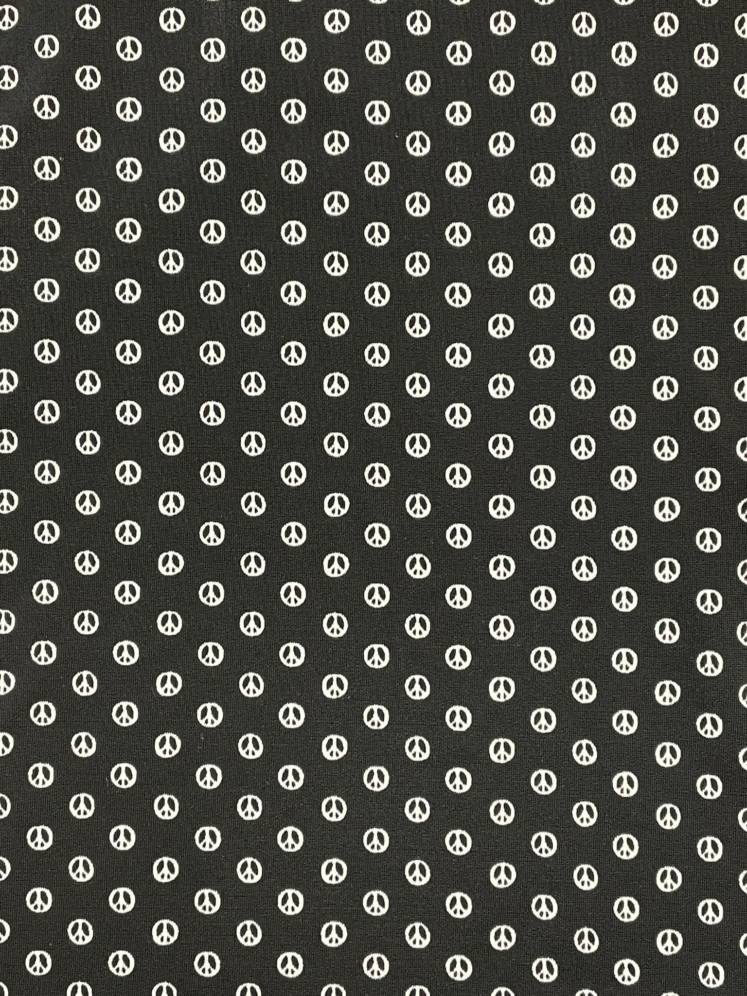 1+ YD Lycra Spandex Knit - Black with White Peace Symbols