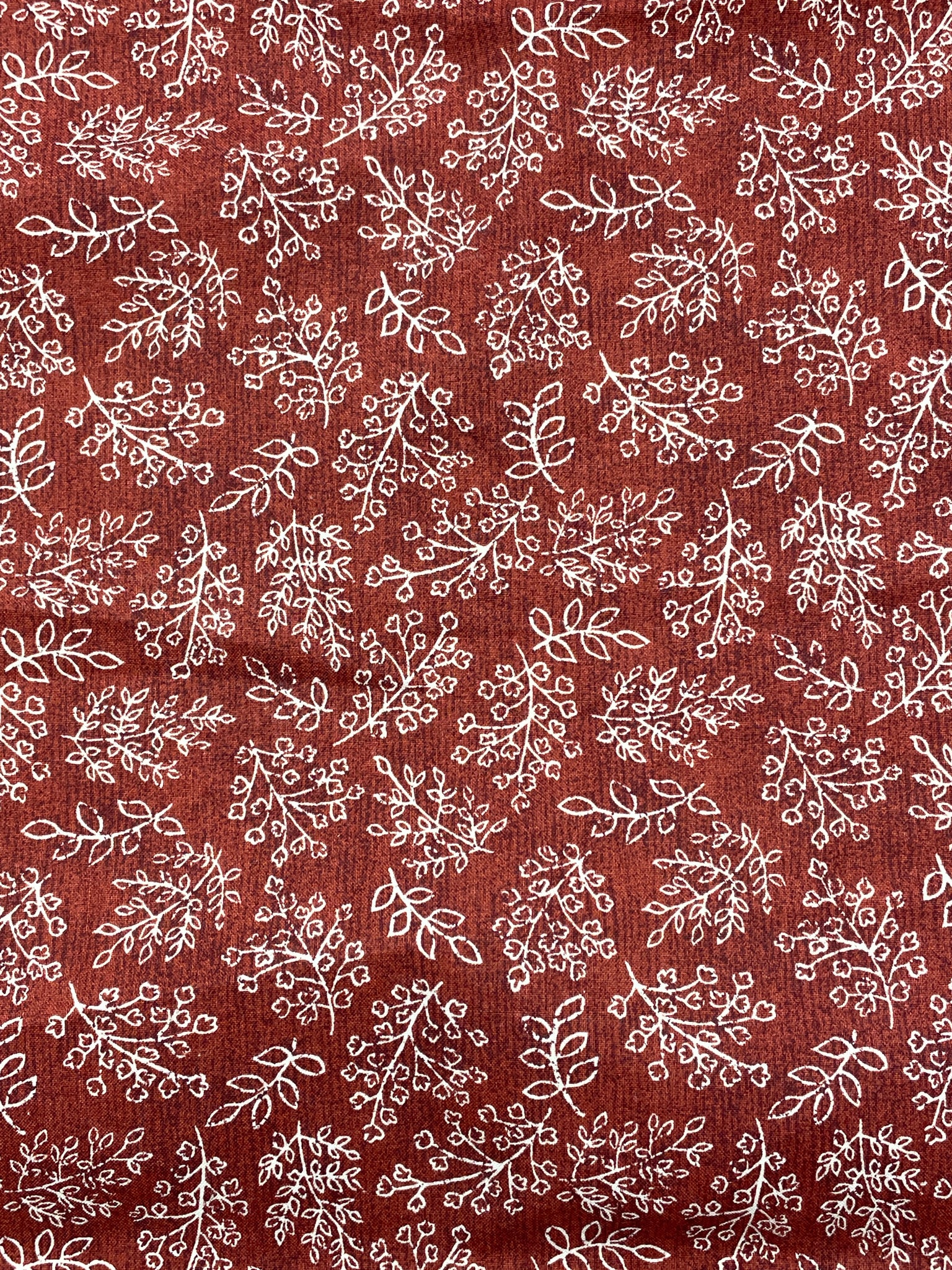 Quilting Cotton - Mottled Brick Red with Off White Leaves