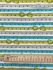 1 1/2 YD Quilting Cotton - White with Green, Turquoise and Gray Tape Measures