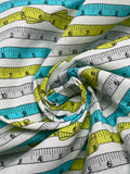 1 1/2 YD Quilting Cotton - White with Green, Turquoise and Gray Tape Measures