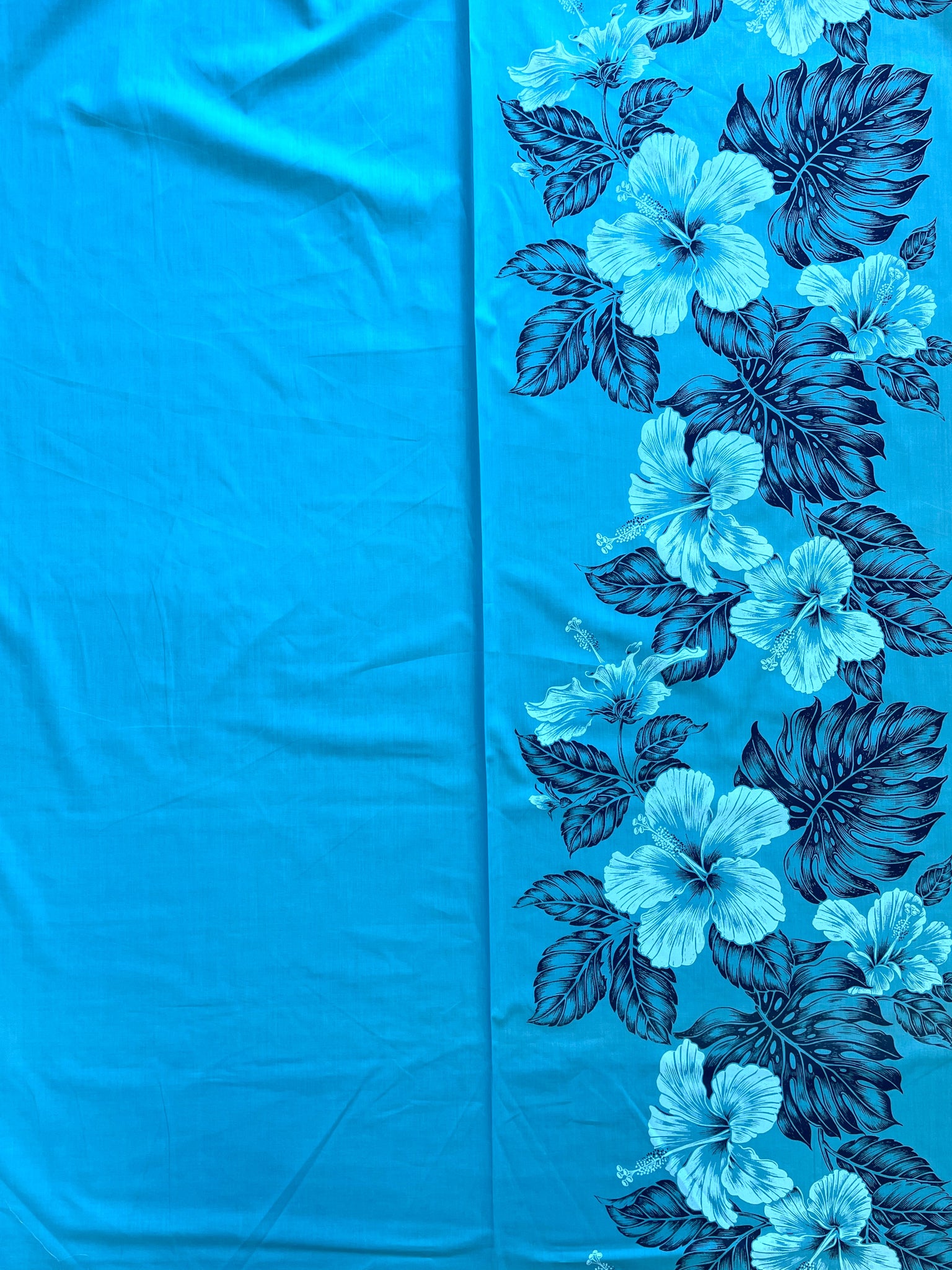 2009 Poly Cotton - Turquoise with Pale Blue Hibiscus and Navy Blue Leaf Border